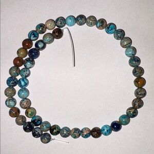 15.75” Strand Of Blue And Brown 8 mm Round Stones